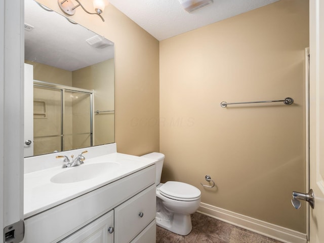 bathroom with walk in shower, tile patterned floors, toilet, a textured ceiling, and vanity