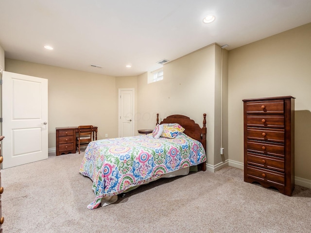 bedroom with light colored carpet