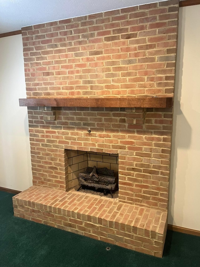 interior details with carpet, ornamental molding, and a brick fireplace