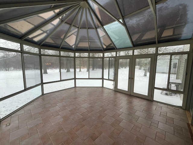 unfurnished sunroom with french doors