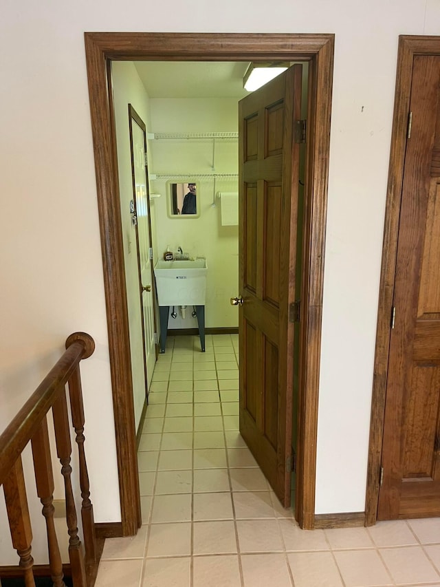 corridor featuring light tile patterned floors