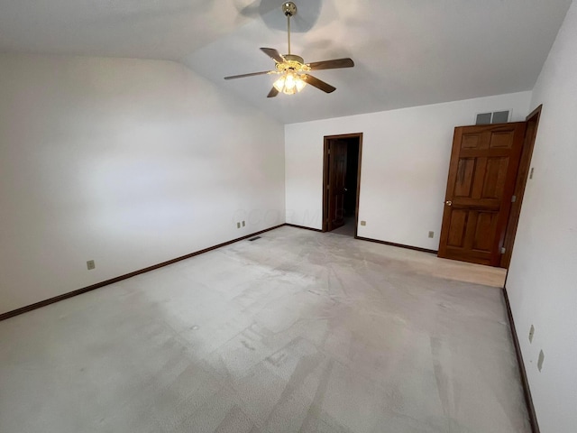 unfurnished bedroom featuring ceiling fan, light colored carpet, and lofted ceiling