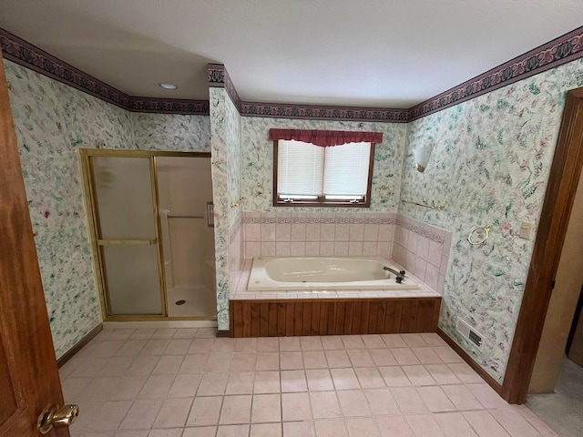 bathroom featuring tile patterned flooring and independent shower and bath