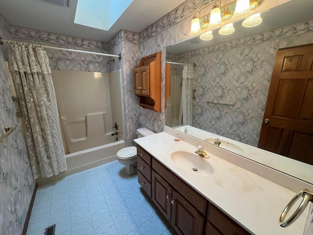 full bathroom with a skylight, vanity, shower / tub combo, and toilet