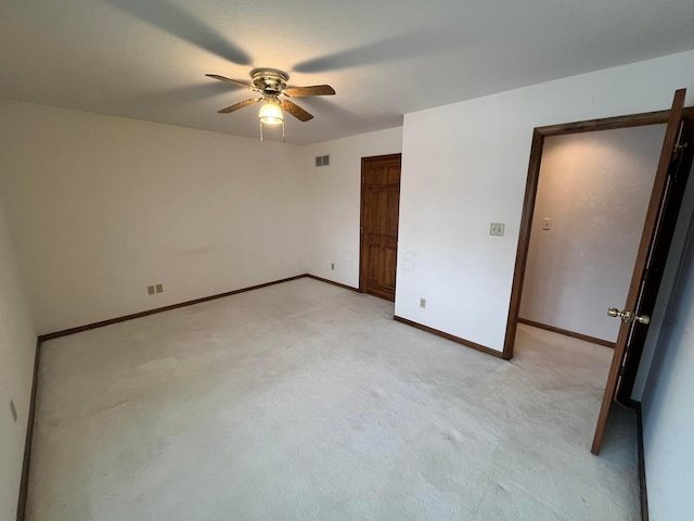 unfurnished bedroom with light carpet and ceiling fan