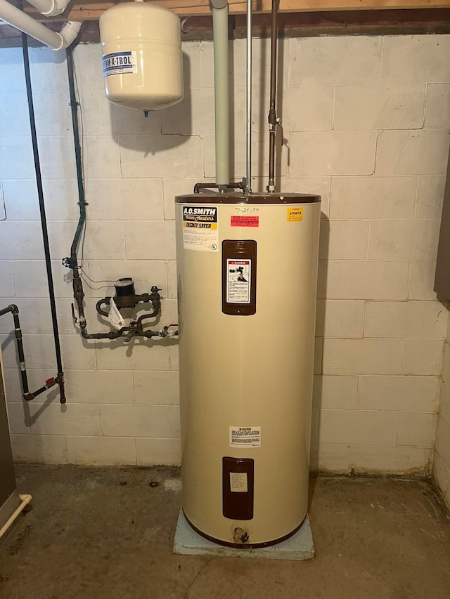 utility room with electric water heater