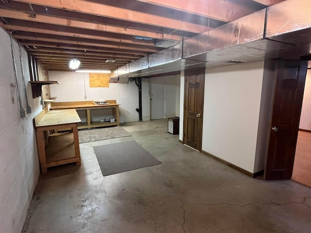 basement with a workshop area