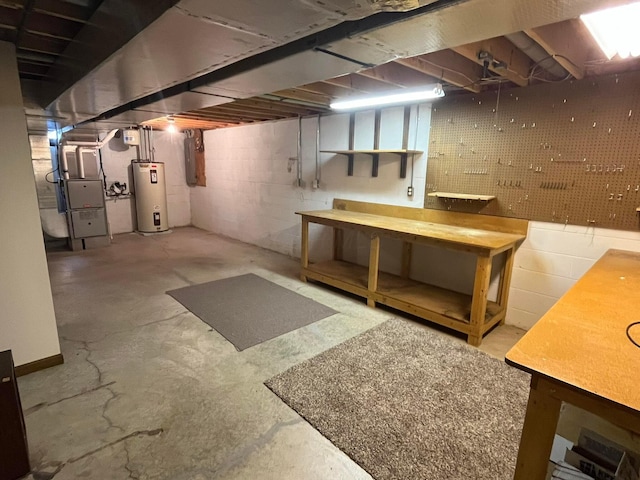 basement with a workshop area, electric water heater, electric panel, and heating unit