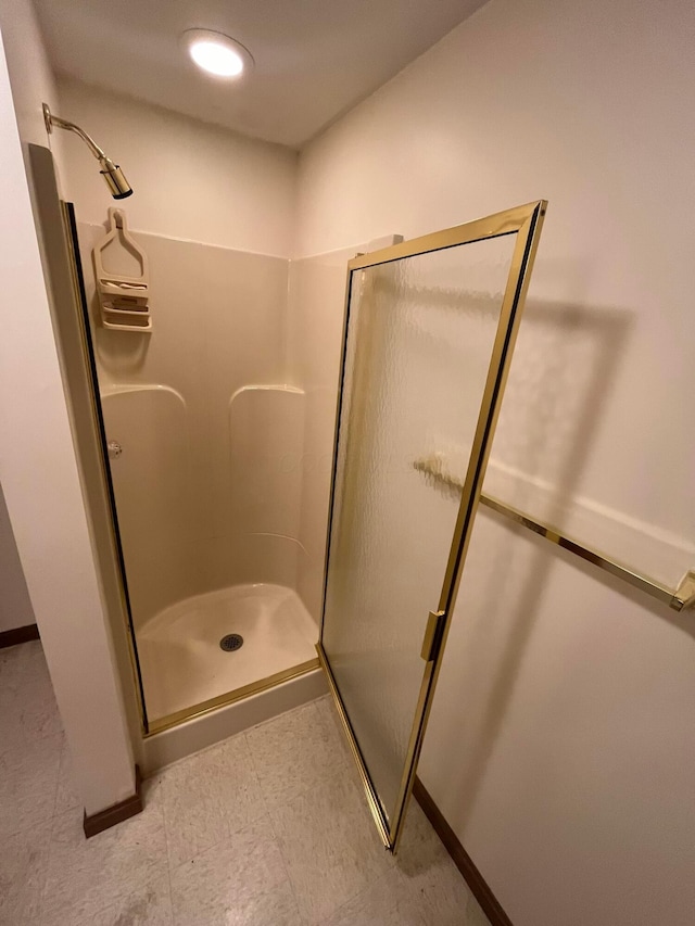 bathroom featuring an enclosed shower