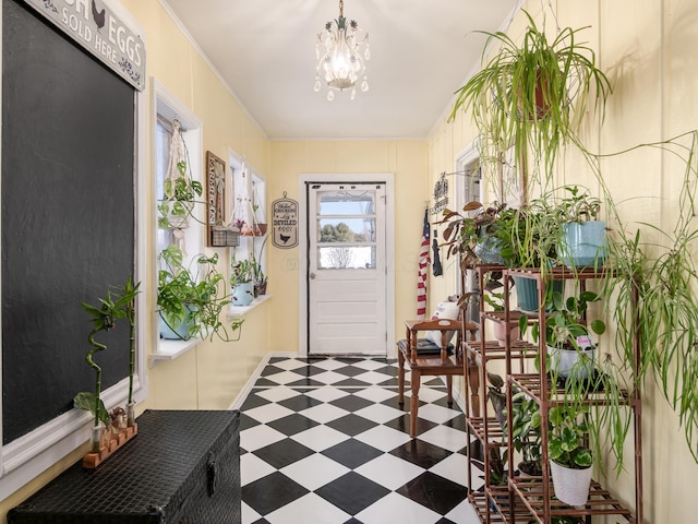 foyer entrance with a notable chandelier