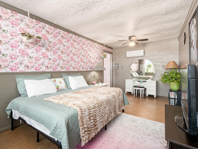 bedroom featuring ceiling fan, a textured ceiling, and a wall unit AC