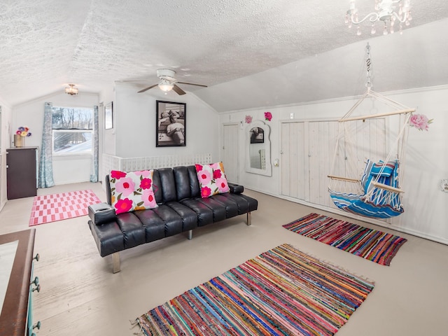 living room featuring a textured ceiling, ceiling fan, and lofted ceiling