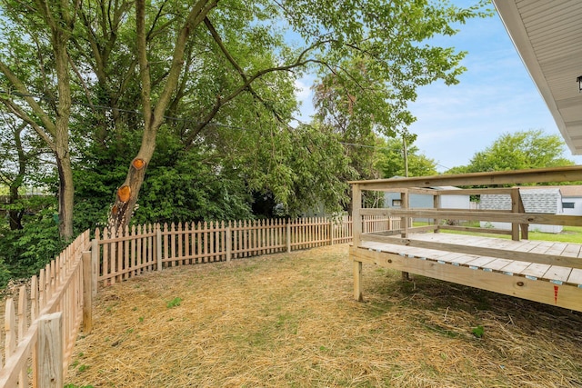 view of yard with a wooden deck