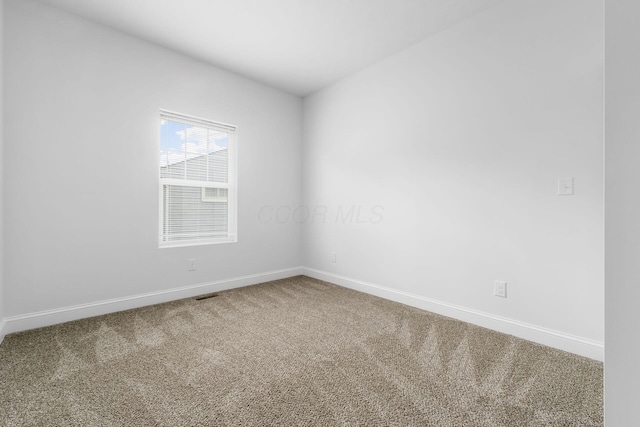 spare room with carpet floors