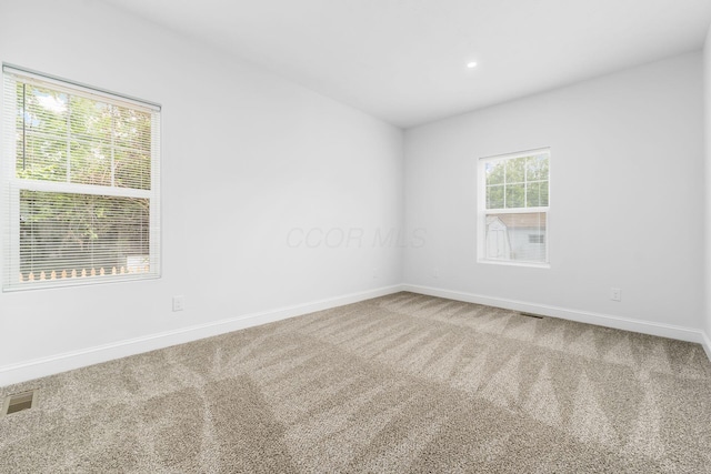 view of carpeted spare room