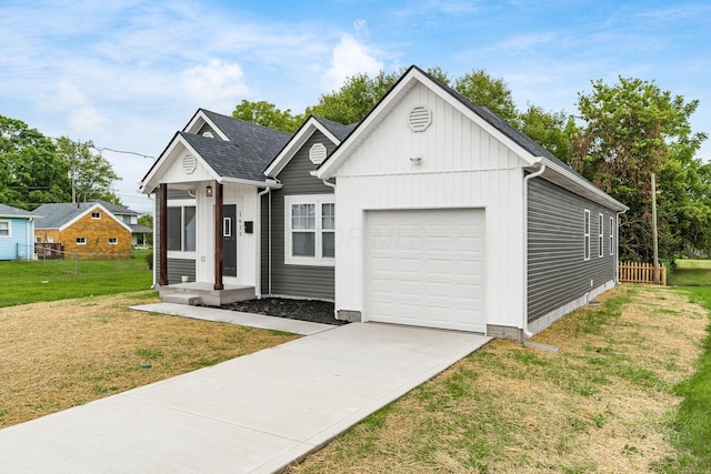 view of front of house featuring a front yard and a garage