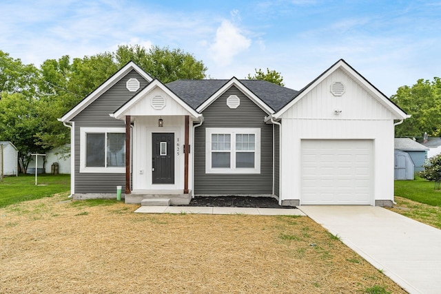 view of front facade with a front yard and a garage