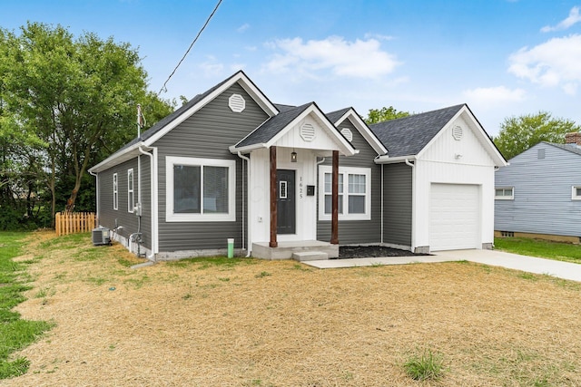 view of front of house featuring central AC and a garage