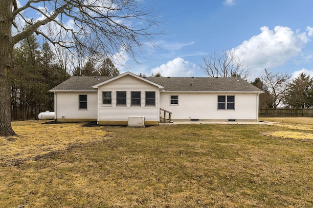 back of house featuring a yard