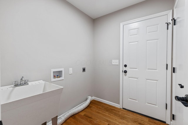 laundry area with washer hookup, hardwood / wood-style floors, sink, and hookup for an electric dryer