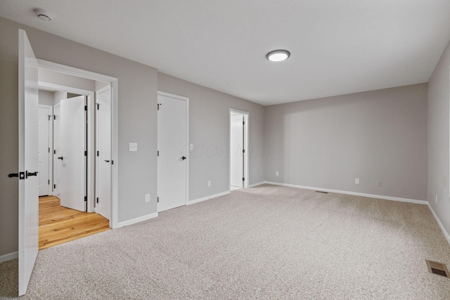 unfurnished bedroom with carpet