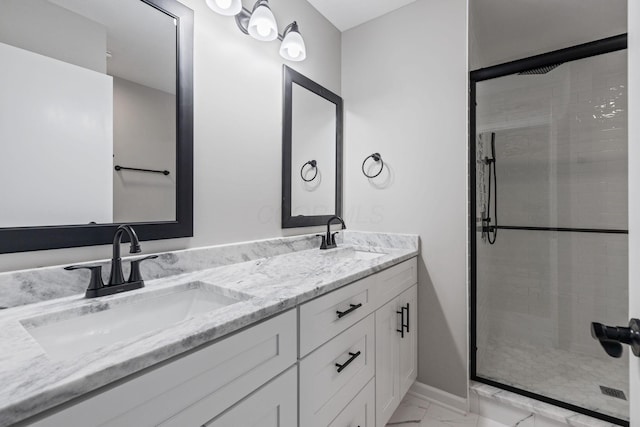 bathroom featuring vanity and a shower with door