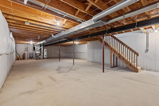 basement with electric water heater and heating unit