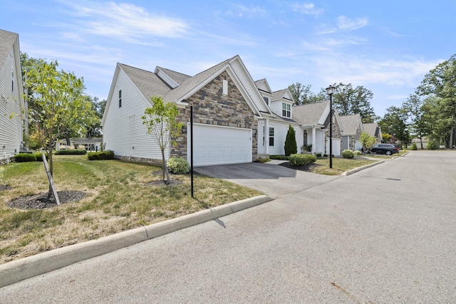 view of front of home featuring a front lawn and a garage