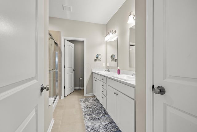 bathroom with vanity and walk in shower