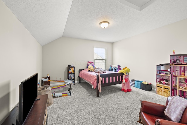 carpeted bedroom featuring a textured ceiling and vaulted ceiling