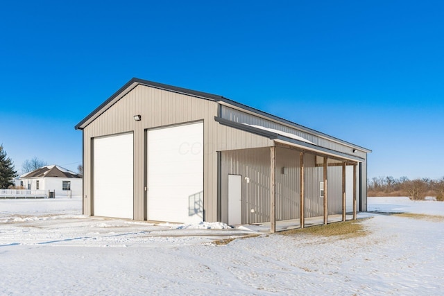 view of snow covered garage