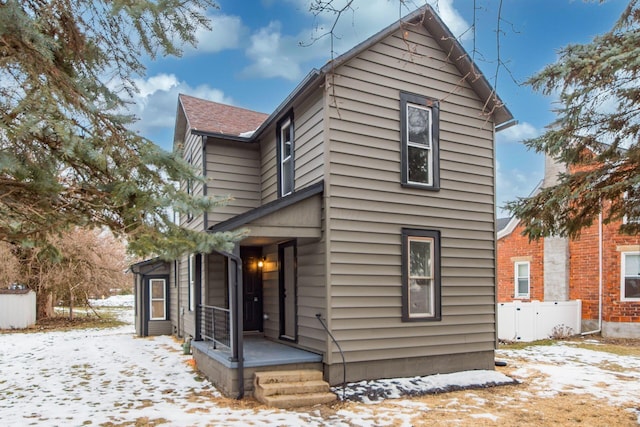 view of snow covered house