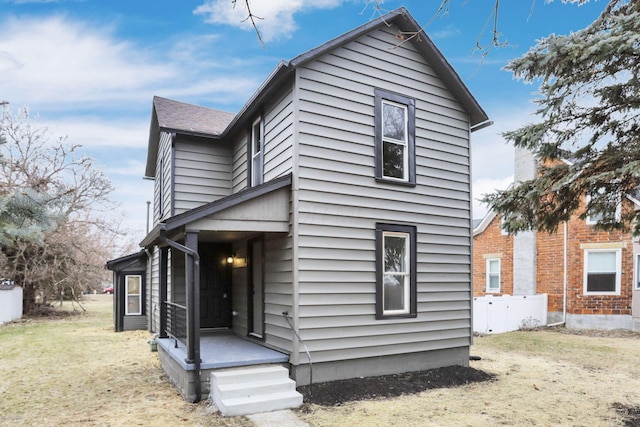 rear view of house with a lawn