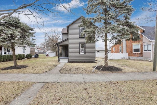 view of front of house featuring a front yard and covered porch