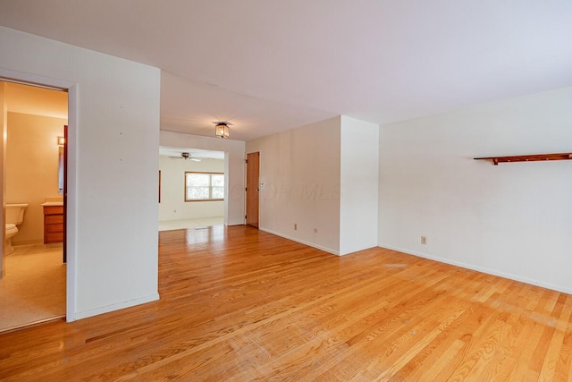 unfurnished room featuring ceiling fan and light hardwood / wood-style floors