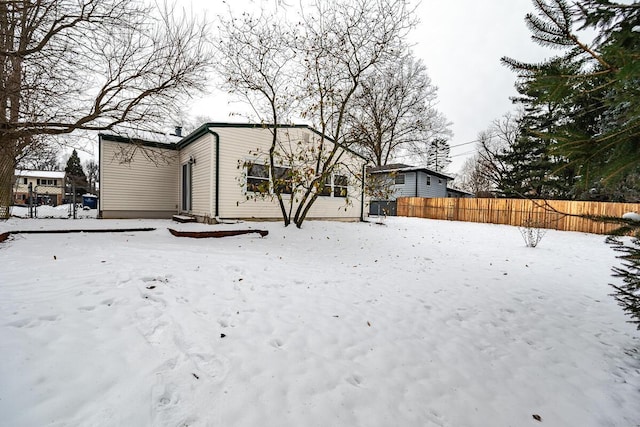 view of snow covered house