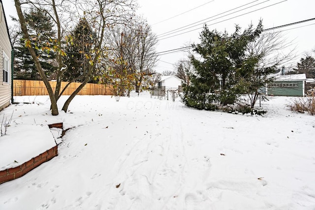 view of yard covered in snow