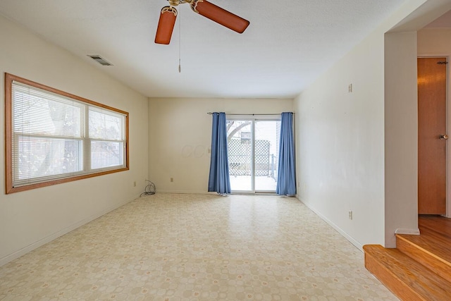 unfurnished room featuring ceiling fan