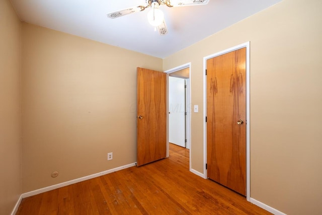 unfurnished bedroom featuring ceiling fan and light hardwood / wood-style flooring