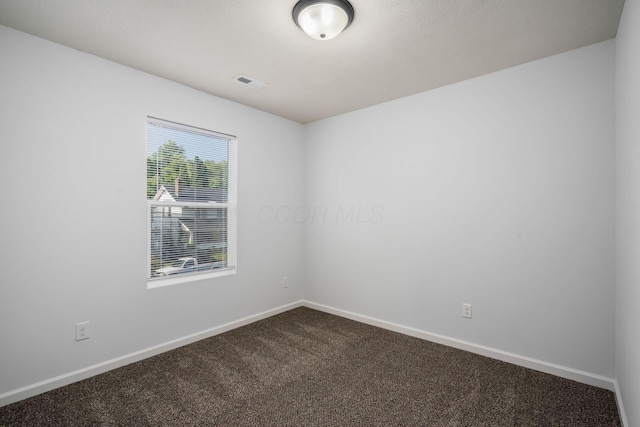 empty room featuring carpet floors