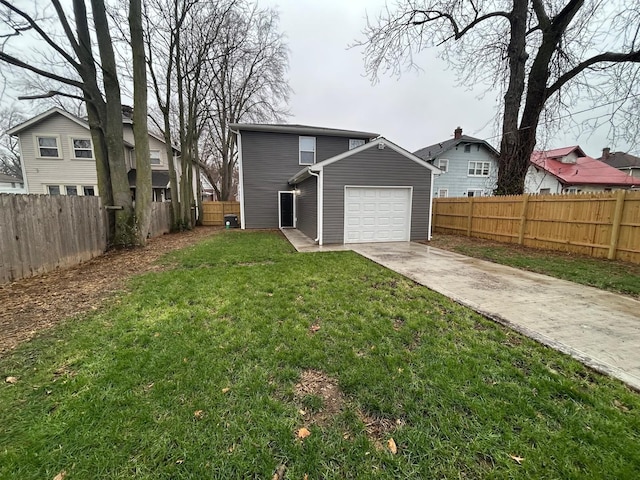 view of front of property featuring a garage and a front lawn