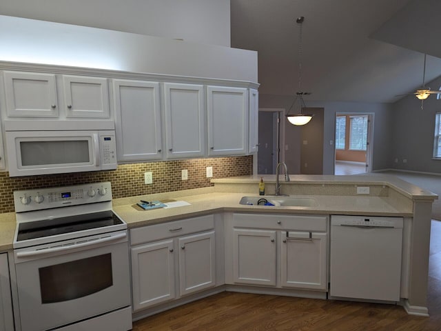 kitchen with sink, white cabinets, hanging light fixtures, and white appliances