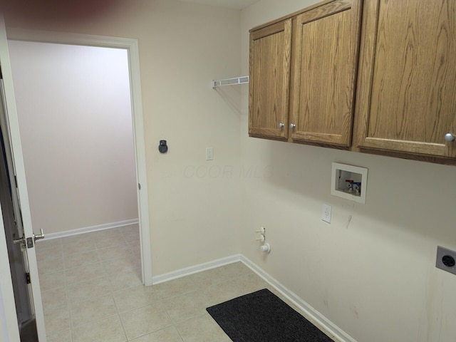 clothes washing area with gas dryer hookup, cabinets, hookup for a washing machine, light tile patterned floors, and hookup for an electric dryer