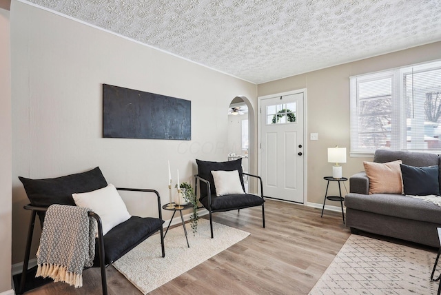 interior space with light wood-type flooring and ceiling fan