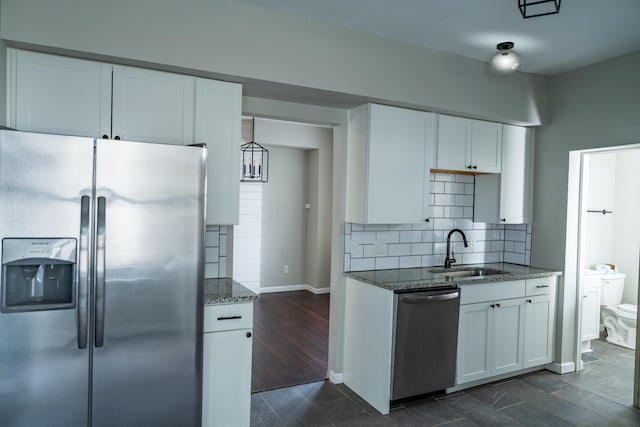 kitchen with sink, white cabinetry, and appliances with stainless steel finishes