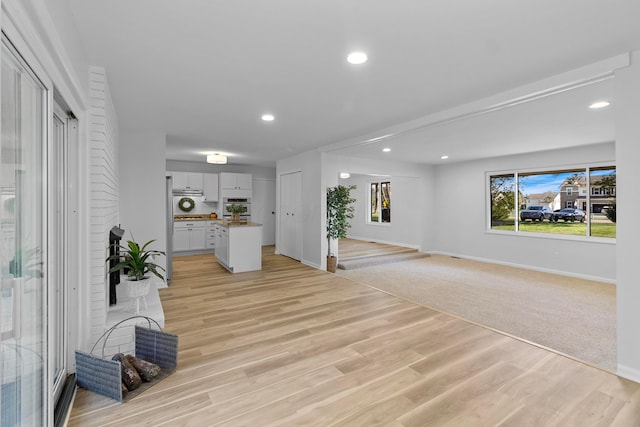 unfurnished living room with light hardwood / wood-style floors