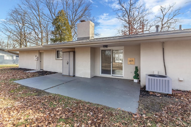 back of house with a patio and central air condition unit