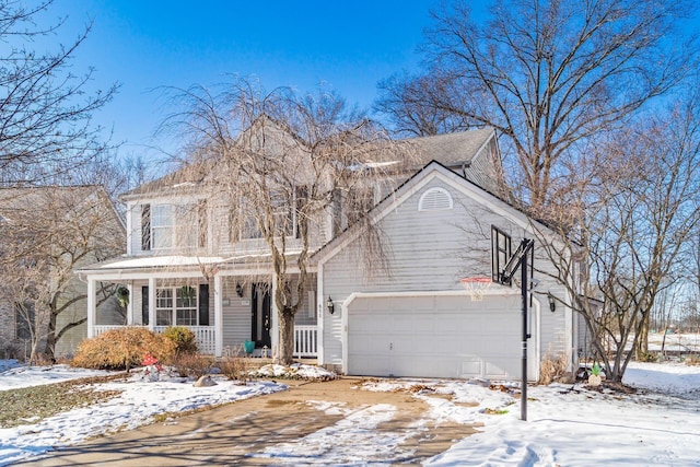 view of front of home with a garage and covered porch