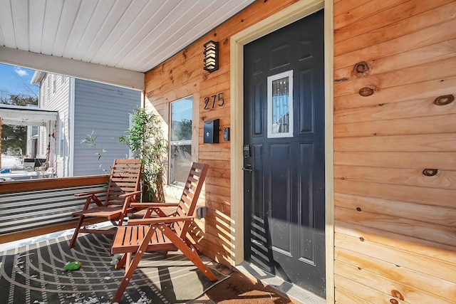 property entrance featuring covered porch