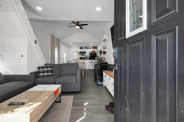 living room with ceiling fan, hardwood / wood-style floors, and high vaulted ceiling